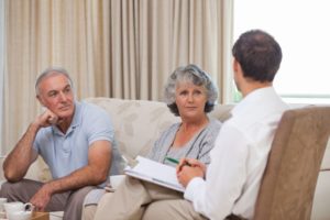 senior couple meeting with insurance broker
