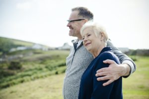 Happy old couple standing together