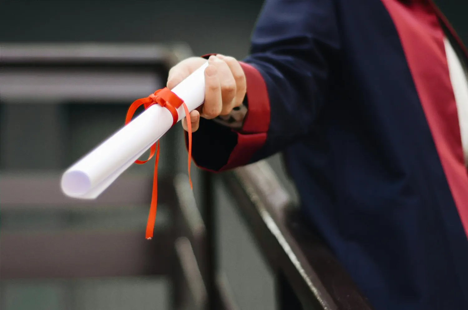person holding diploma