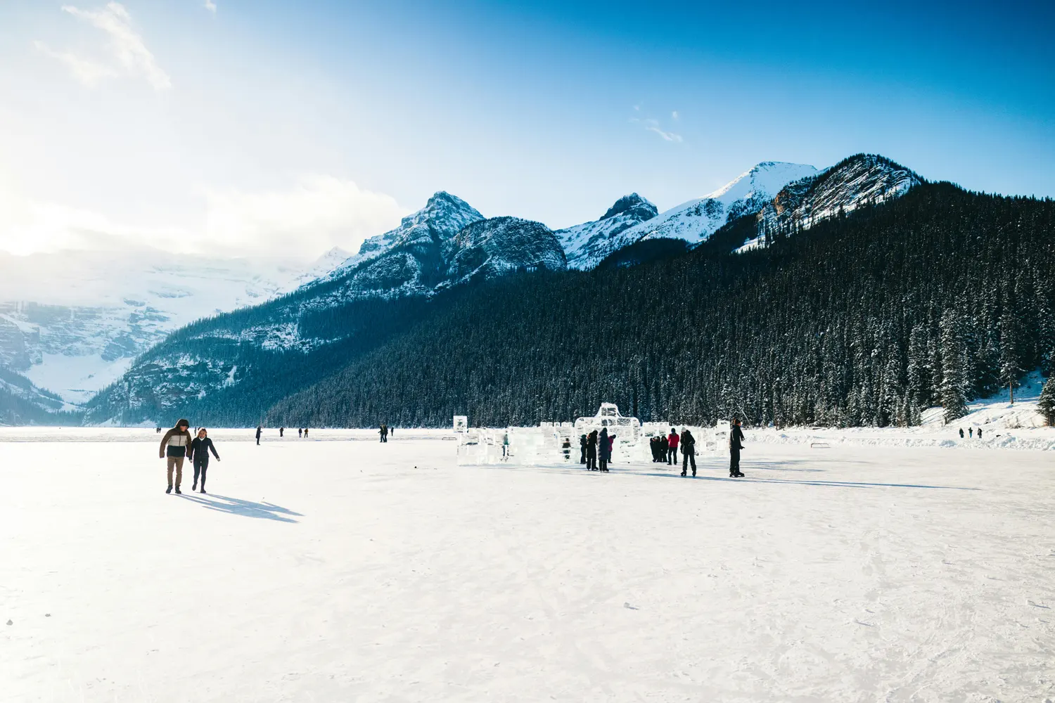 families skating in winter in Banff, Alberta, Canada