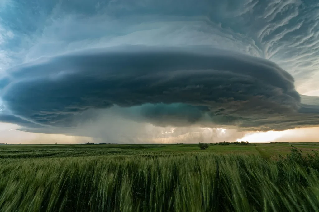 huge storm cloud looming over Saskatchewan farm field