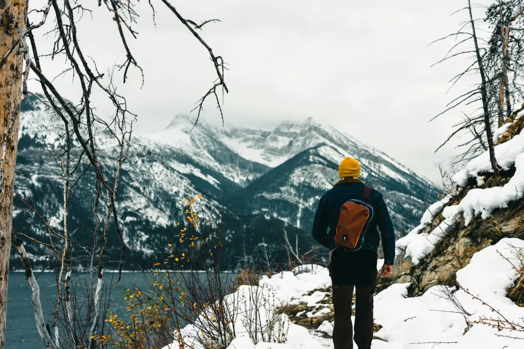 Man looking out at a lake in rural Alberta Canada