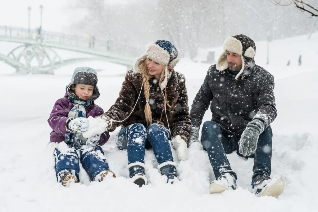 Canadian family playing in the snow