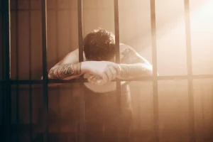 person in a jail cell