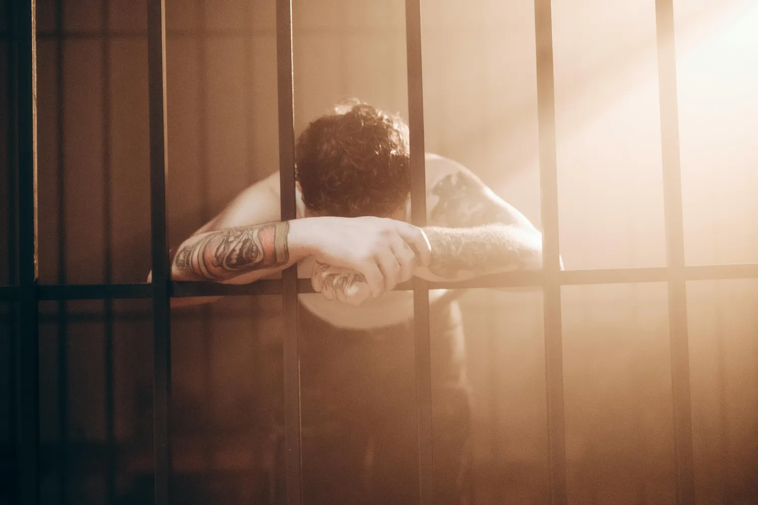 person in a jail cell